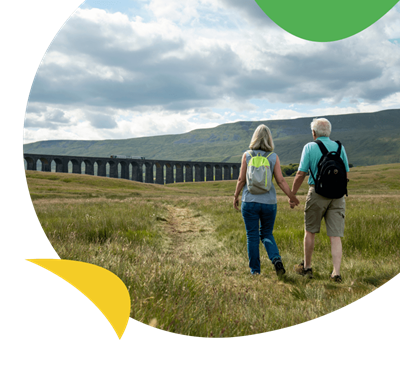 A couple walking across fields