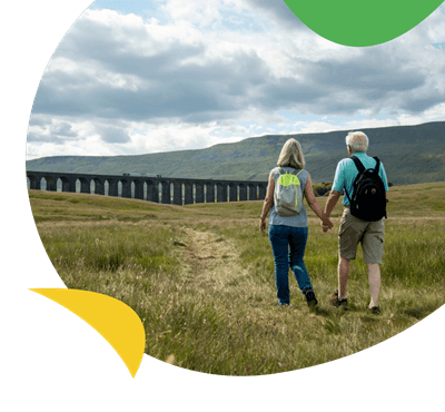 A couple walking across fields