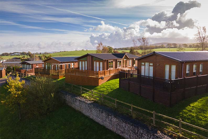 A view of luxury lodges overlooking the Lancashire countryside