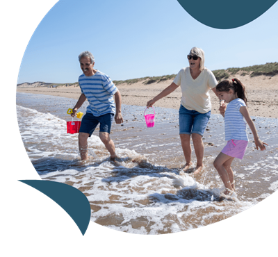 A family enjoying the sea at Crimdon Dene beach