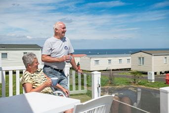 A couple enjoying their very own lodge in Northumberland