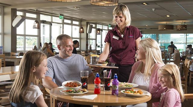 A family enjoying a meal in the restaurant