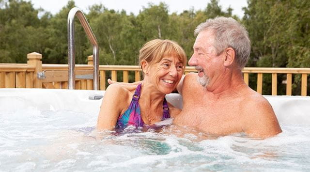 A couple enjoying their lodge hot tub
