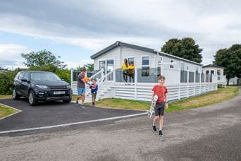 A family enjoying their lodge holiday home in Scotland