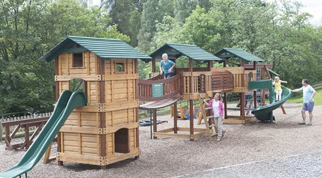 Children playing on an adventure playground at a Parkdean Resorts Holiday Park