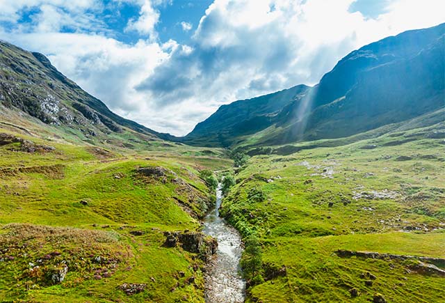 A stream flowing through Glencoe in Scotland