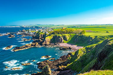 An aerial view of St Abbs on Scotland's coast in the summer