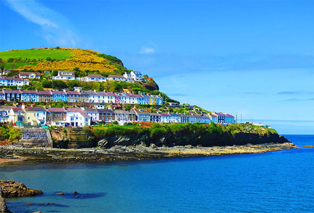 Colourful houses overlooking the sea in Wales