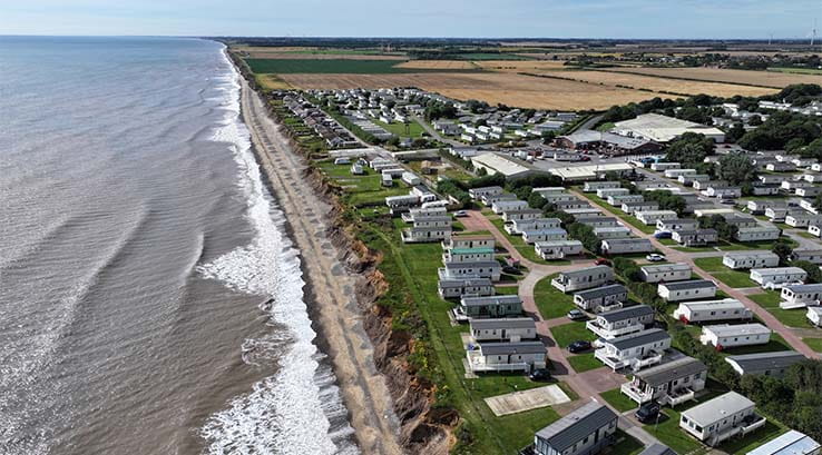 An aerial view of a holiday park, with caravans overlooking the Yorkshire coast