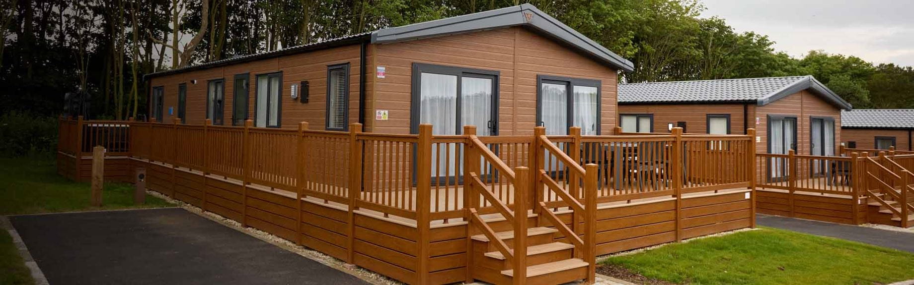 A row of hot tub lodges at Cayton Bay Holiday Park in Yorkshire