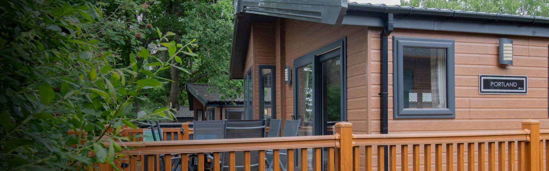 A luxury lodge surrounded by woodland