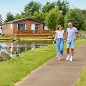Couple walking by lodge
