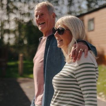 Couple walking arm in arm
