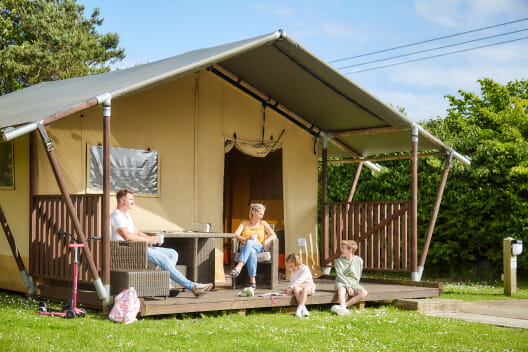 Family enjoying glamping hut