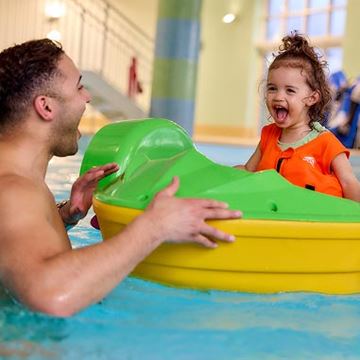 Little girl in boat at Parkdean Resorts