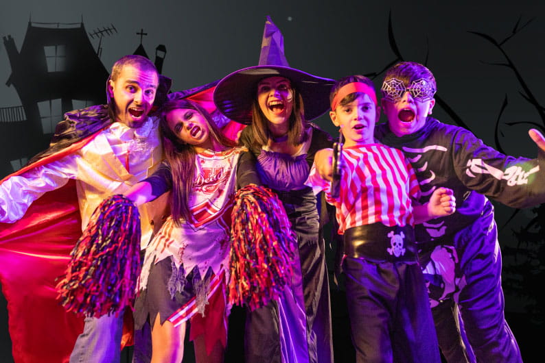 Kids dressed up in Halloween costumes
