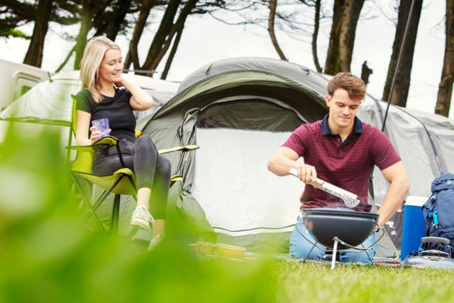 Couple sat with a disposable bbq