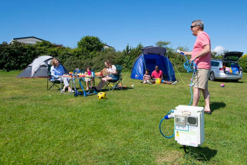 Family on grass pitch