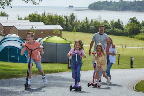 family on scooters