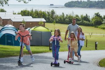 family on scooters