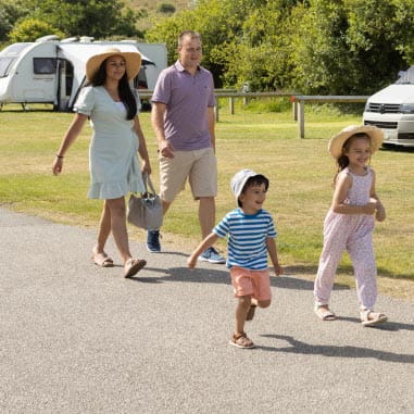 Family walking through Parkdean Resorts