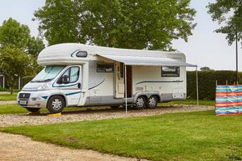couple enjoying breakfast together on a caravan veranda