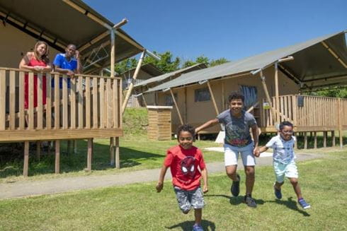 Family outside glamping