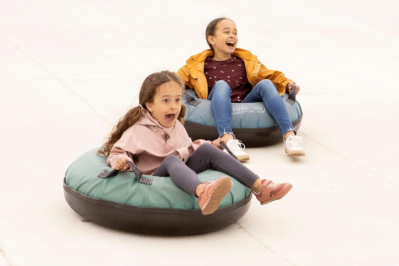 two young kids in ring tubes
