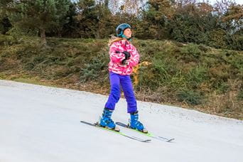 a child on ski's skiing
