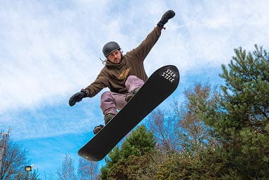 a snowboarder in a mid air jump