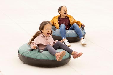 two young kids in ring tubes