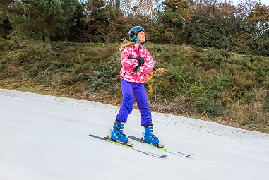 a child on ski's skiing
