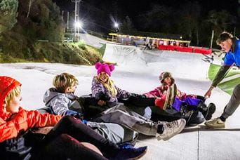 a group of kids on the ski slope