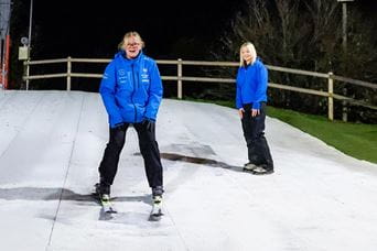 two people on a ski slope
