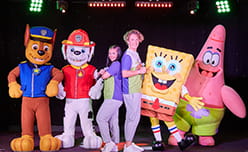 Paw Patrol and Spongebob characters on stage at Parkdean Resorts