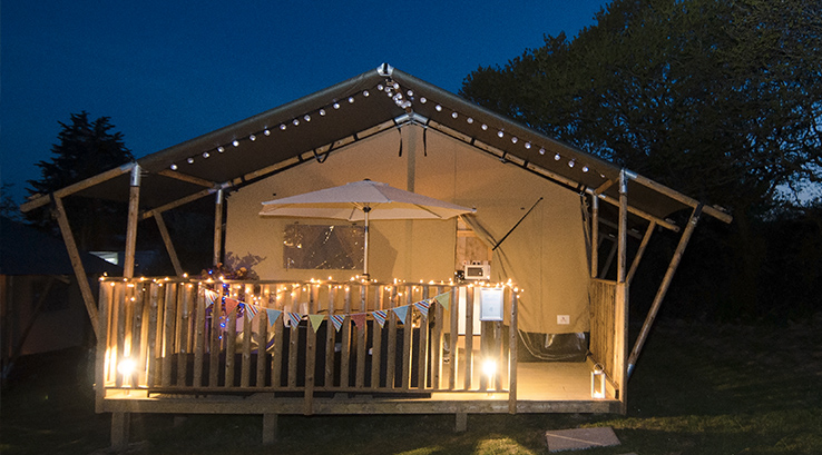 Glamping Safari Tent at night with fairylights, near Isle of Wight