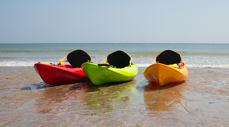 Three kayaks on the beach