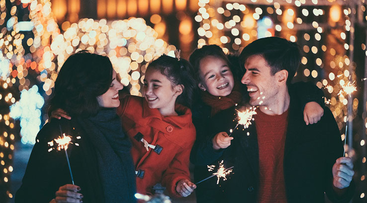 Family enjoying sparklers 