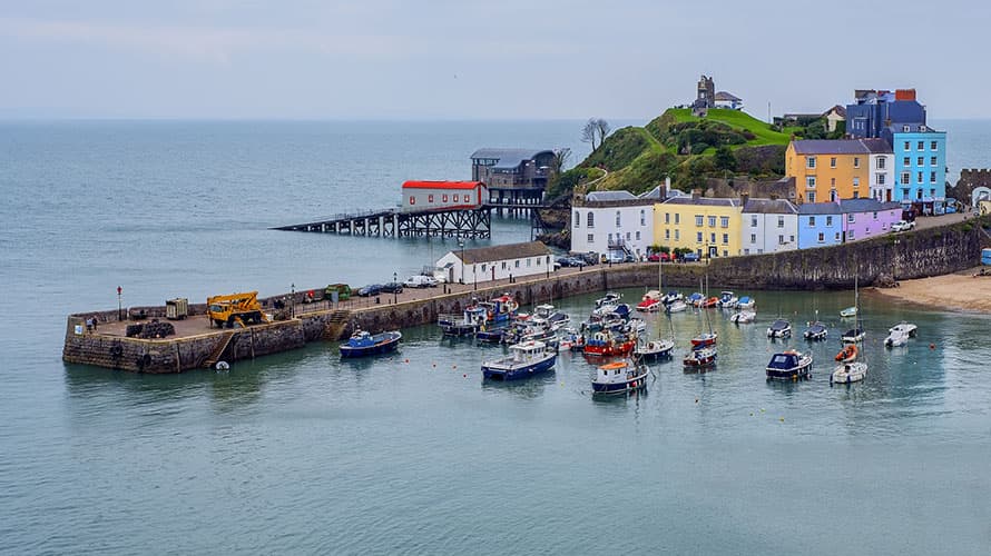 Fishing boats and colourful houses in Tenby, Wales