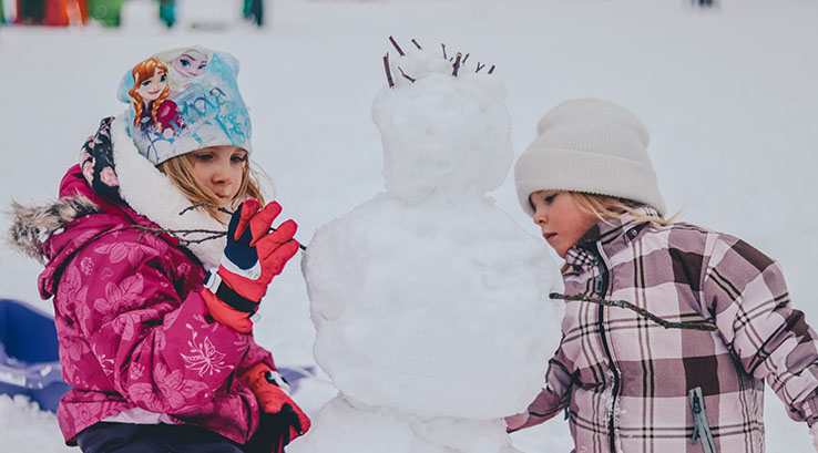 Children building a snowman