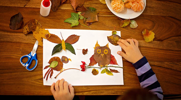 A child enjoying some autumn crafts