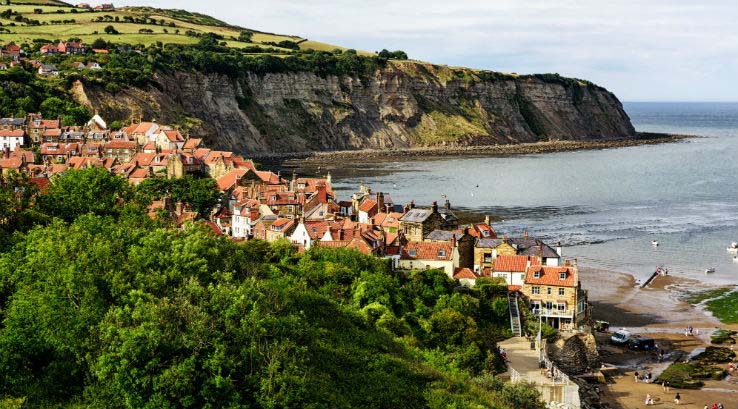 A view across the town and beach of Robin Hood's Bay, Yorkshire