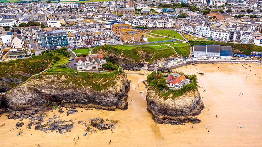 The iconic Island House on Towan Beach, set against Newquay's town centre