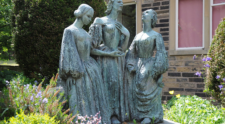A statue of the Bronte sisters