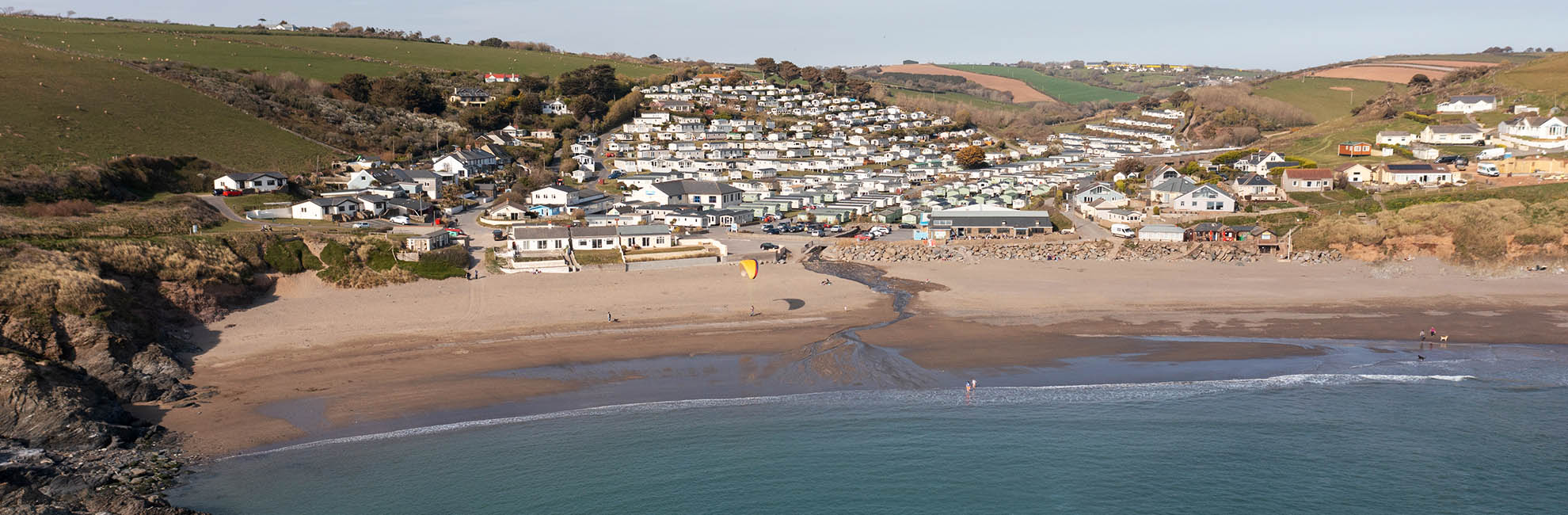 Aerial view of Challaborough Bay Holiday Park and beach