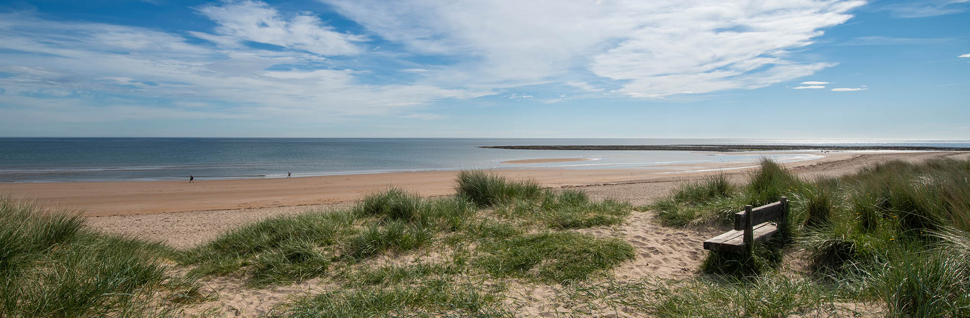 A view across the sand dunes towards the beach at Cresswell Towers