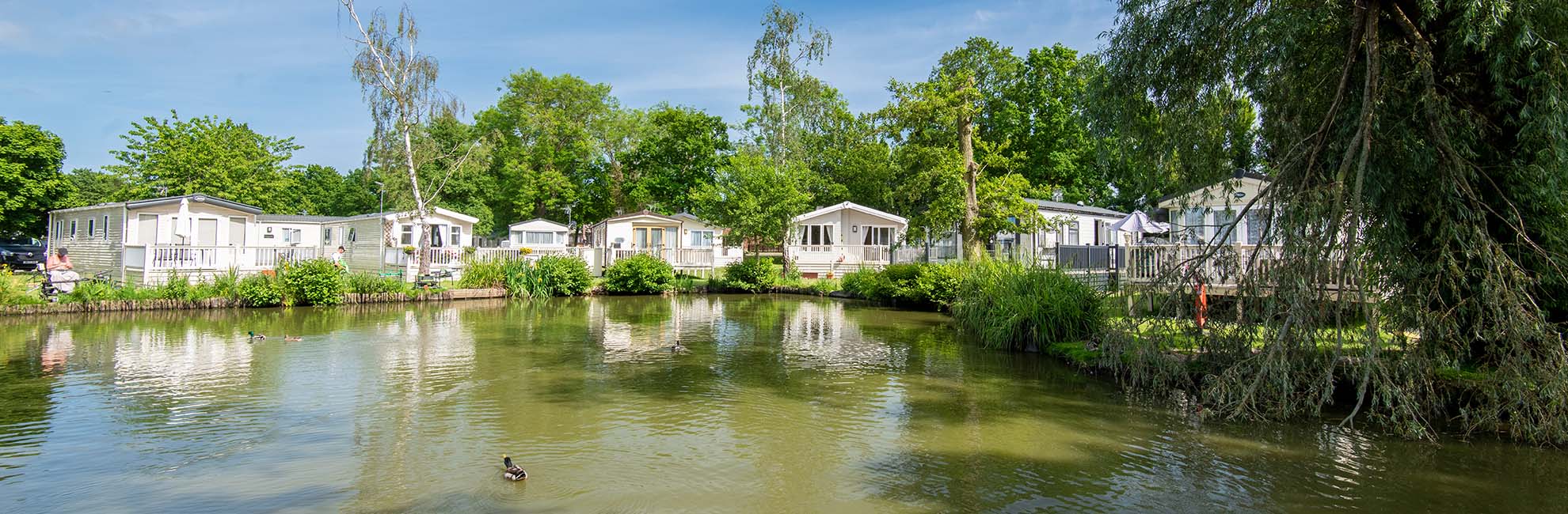 The accommodation by the fishing lake at Weeley Bridge Holiday Park