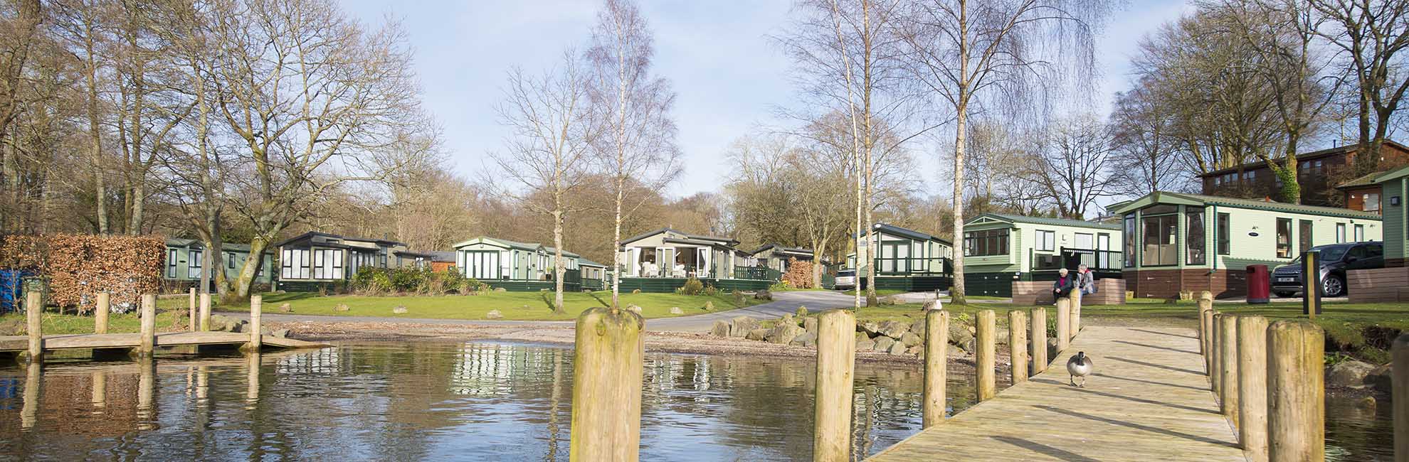 Lodges by the lake at a Lake District holiday park