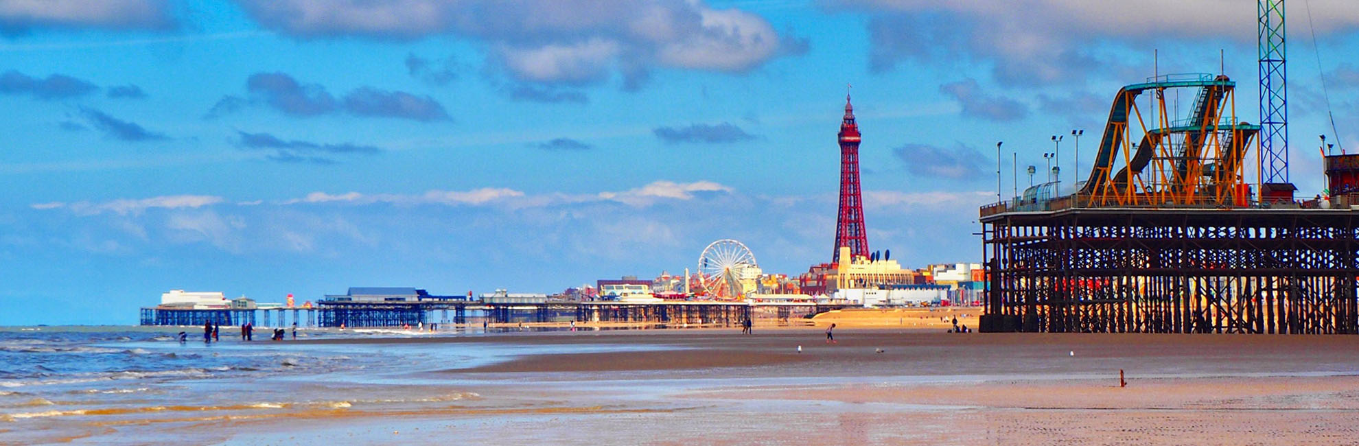 A view across the beach of Blackpool Tower and the Pleasure Beach