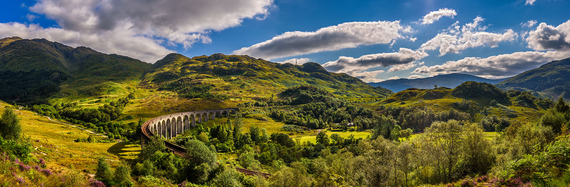 A sunny day over the Glenfinnan Viaduct in Scotland